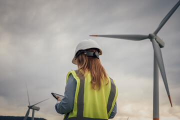 Poster - Wind Energy Technician Monitoring Turbines with Tablet in Renewable Energy Field