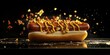 © Kamonwan - Delicious hot dog with mustard and sprinkles of toppings on a black background.