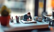 © jambulart - Tiny figurine writing in notebook on desk.
