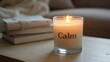 © GMeta - Tranquil Calm candle on table with books  blanket