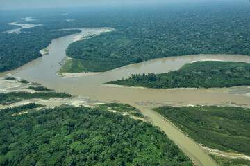 flying over manu river on tambopata natural reserve. madre de dios peru.