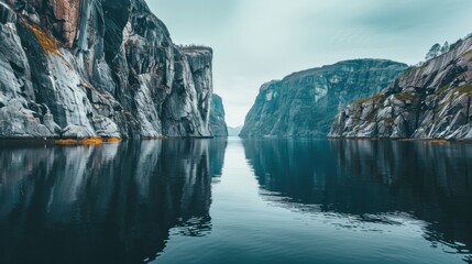 Aufkleber - A tranquil fjord with calm, reflective waters and steep, towering cliffs