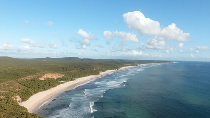 Poster - Aerial view of a secluded beach with white sand and blue waters.