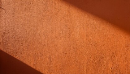 Poster - Warm Textured Orange Stucco Wall with Strong Diagonal Sunlight Shadow. Ideal for Rustic and Minimalist Backgrounds, Mood Boards, or Creative Design Concepts Evoking Warmth and Natural Texture