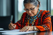 © SnapVault - Elder indigenous woman in vibrant attire signs document with a thoughtful expression, showcasing cultural pride and dedication, blending tradition with formality , cultural pride