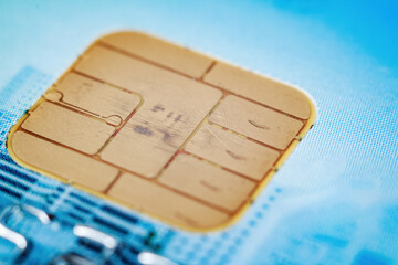 Close-up of a bank card chip demonstrating contactless payment