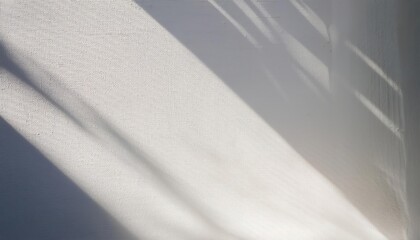 Poster - Minimalist Textured White Wall with Diagonal Sunlight and Shadows. Perfect for Backgrounds, Web Banners, or Modern Design Concepts