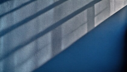 Poster - Abstract Textured Blue Wall with Diagonal Shadows from Sunlight through Window, Minimalist Background for Creative Design, Modern Art Concepts, or Architectural Visualization Projects