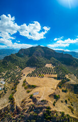 Aerial view with drone; Sardes (Sardis) Ancient City which has gymnasium and synagogue ruins and columns in Manisa, Turkey.
