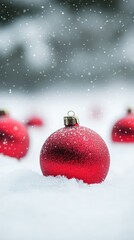 Poster - Single red Christmas bauble in snow with soft snowfall in the background. Classic for Christmas and New Year.