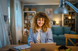 © Miljan Živković - one woman adult caucasian work on her laptop at home happy smile