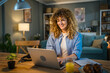 © Miljan Živković - one woman adult caucasian work on her laptop at home happy smile