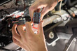 © Евгений Вершинин - Skilled Hands Connecting Various Electrical Connectors in Automotive Repair Services and Maintenance