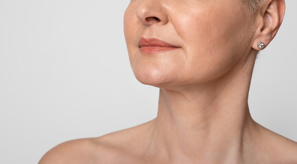 skin lifting. cropped image of mature woman with smooth skin over light background, closeup