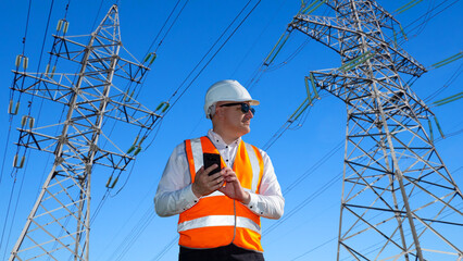 Poster - man from energy companies. high voltage power lines. engineer near metal supports. energy company em