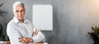 © Prostock-studio - Business Leadership Concept. Confident Mature Businessman Crossing Hands Looking At Camera Standing In Modern Office. Copy Space