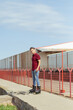 © ADDICTIVE STOCK - Young man rollerblading in urban setting