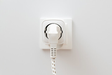 White plug with a white cord attached to it