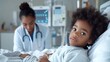 © ismel leal - Niño afroamericano es atendido en el hospital, se encuentra enfermo y la doctora le da atenciones especiales.