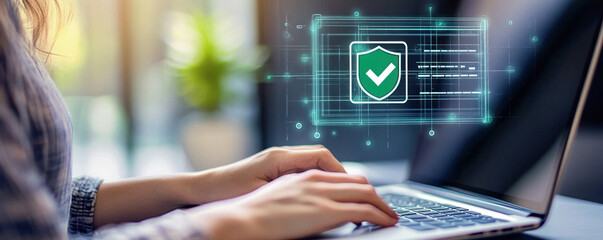 Poster - A woman is typing on a laptop with a green check mark on the screen. The check mark represents a security feature, indicating that the laptop is protected from unauthorized access