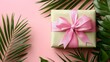 © DG - Eco-friendly gift wrapped in pastel pink paper with a pink ribbon, adorned with green foliage, blending sustainability with a fresh, festive look.