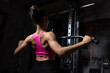© kamonrat - Fit Woman Performing Lat Pulldown Exercise in the Gym, Showing Muscular Back Definition and Dedication to Fitness Training