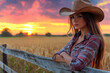 © Aekawat - Focused Ranch Woman with a Determined Expression, Embodying Strength and Grace