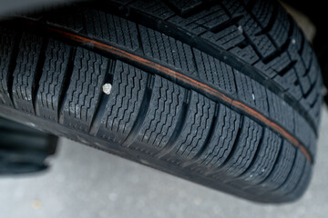 car vehicle tire showing full tread pattern