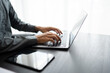 © Charlie's - Business man working with laptop Hands typing  keyboard. Professional investor working new start up project. business planning in office. Technology business..