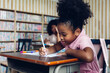 © kanpisut - Girl is study in the Classroom. Back to school! Cute industrious children are sitting at desks indoors. Kids are learning in class.
