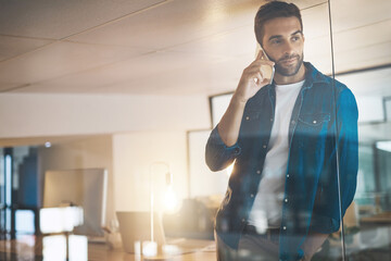 Poster - Man, phone call and thinking at night in office with overtime, update and good news with progress at startup. Person, smartphone and listen with mobile network, discussion and chat at creative agency