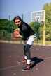 © Guys Who Shoot - a sports ground basketball field active recreation guy in white shorts and black t-shirt plays basketball on camera different tricks