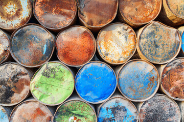 Wall Mural - scenic view of old metal barrels in a port