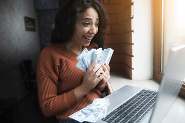 Poster - young girl works money on the internet