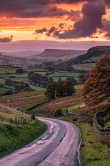 Poster - A rural road stretches into the distance at sunset, with rolling hills and trees lining the way