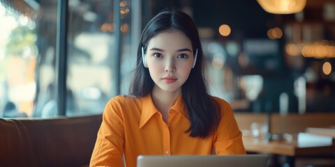 Aufkleber - A person sitting in front of a laptop computer, possibly working or studying