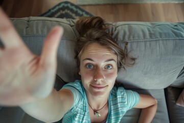 Poster - A woman sits on a couch with her hand raised, possibly waiting for something or trying to get attention