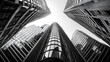 © PBMasterDesign - Skyscrapers viewed from below against a clear sky, monochrome perspective.