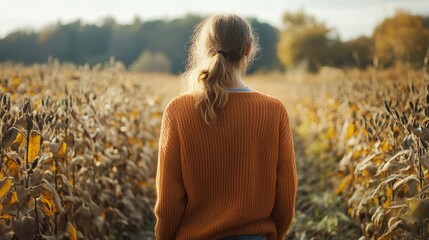 Poster - A person standing among corn stalks