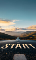 Start line on a long empty road stretching towards the horizon at dawn, representing new beginnings, ambitions, and the path to success