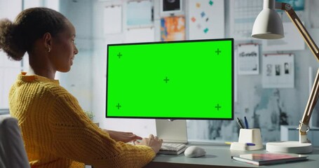Aufkleber - Black Female Engineer Uses Desktop Computer With Green Screen Chroma Key. Modern Office Setup with Creative Entrepreneur doing Technical Work, Resulting in Productivity and Innovation. Arc Medium Shot