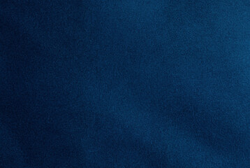 close-up of dark blue fabric texture with a soft, uniform pattern, perfect for backgrounds and desig