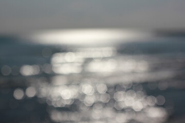 Wall Mural - a blurry dreamy view of waves lapping on the beach.