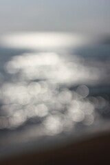 Wall Mural - a blurry dreamy view of waves lapping on the beach.