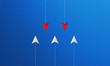 © P.BRICOFA - Conceptual image of leadership with a red paper planes leading white planes. Blue background highlights themes of direction and strategy.