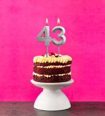 Red velvet cake - Birthday number 43 on a pink background.