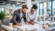 © Tekin - Diverse pair of architects working on a project in a modern office