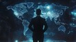 © jamrut - A business leader standing in front of a holographic world map, making decisions based on global analytics