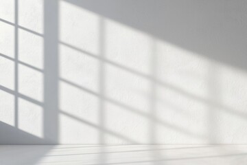 Poster - Bright and minimalistic interior with shadows from a window casting patterns on a smooth white wall, perfect for modern design projects.