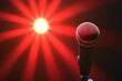 © MohdAdzmer - microphone on stage with red backlight